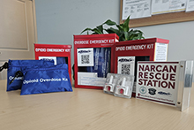 Narcan kits and signs