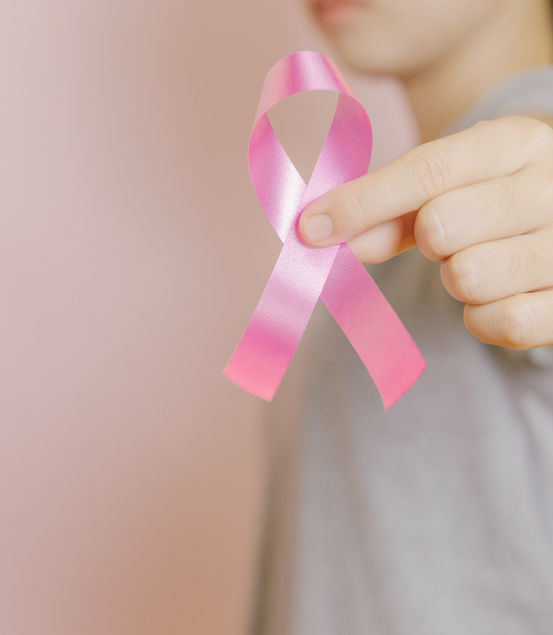 Suicide Prevention month hand holding pink ribbon