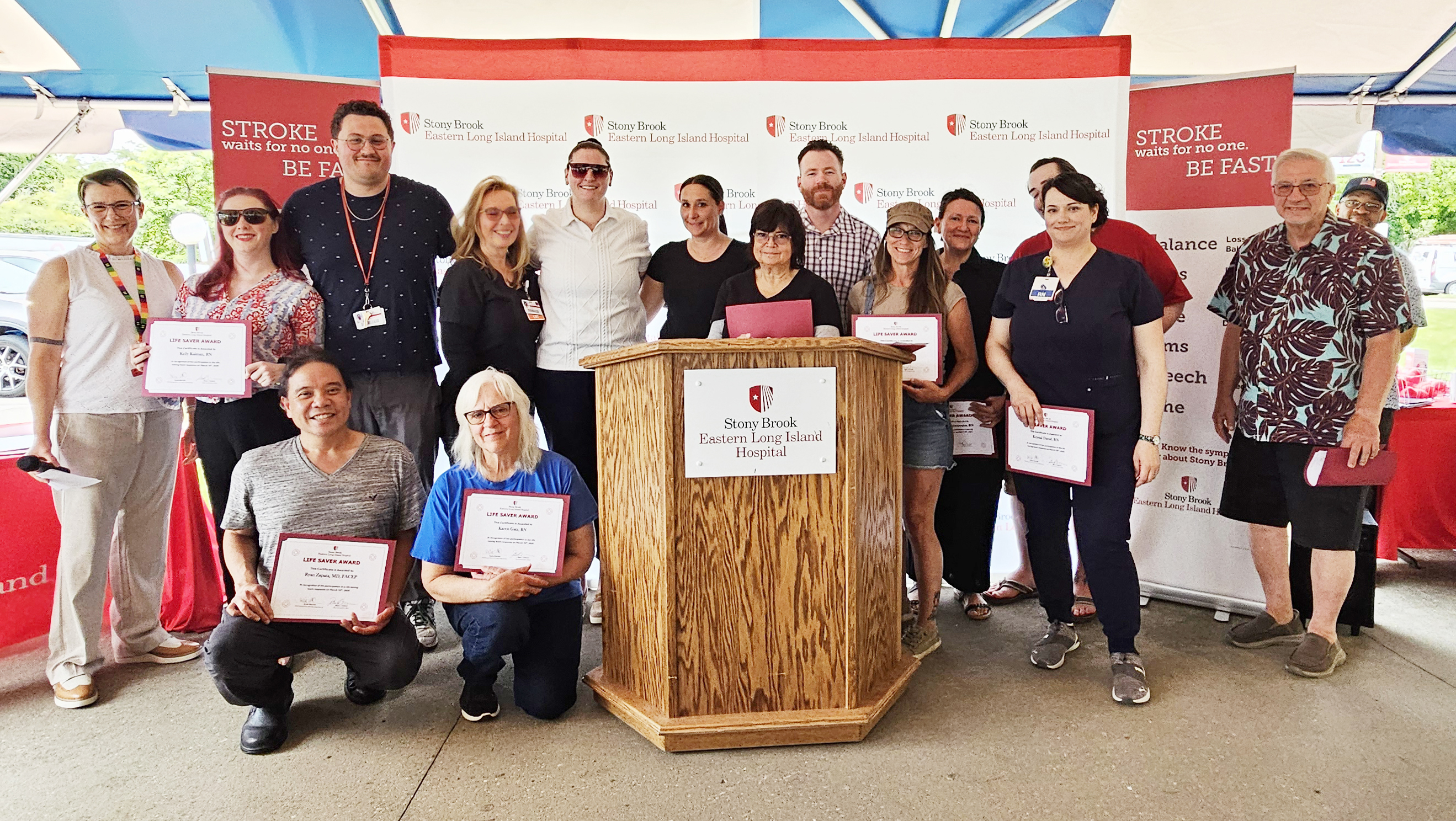 Suzie Marriott, MS, RN, PMH-BC, Chief Nursing Officer and Senior Vice President Patient Care Services (far left) with many of the Life Saver Award recipients Kelly Kalman, RN; Dr. Ryan Zapata; Codey Fisher, Registration Clerk/Switchboard Operator; Kathleen Hauser, Radiology Technologist; Karen Gatz, RN; Amanda Minessali, LPN; Deborah Bondarchuk, Unit Secretary/Ward Clerk; Suzan Bignami, PA-C; Russell Guerrier, RN; Dawn Raynor-Green, PCT; Christina Mantzopoulos, RN; Cory Carberry, PCT; Krystal David, RN; and Richard Perrone, Radiology Technologist