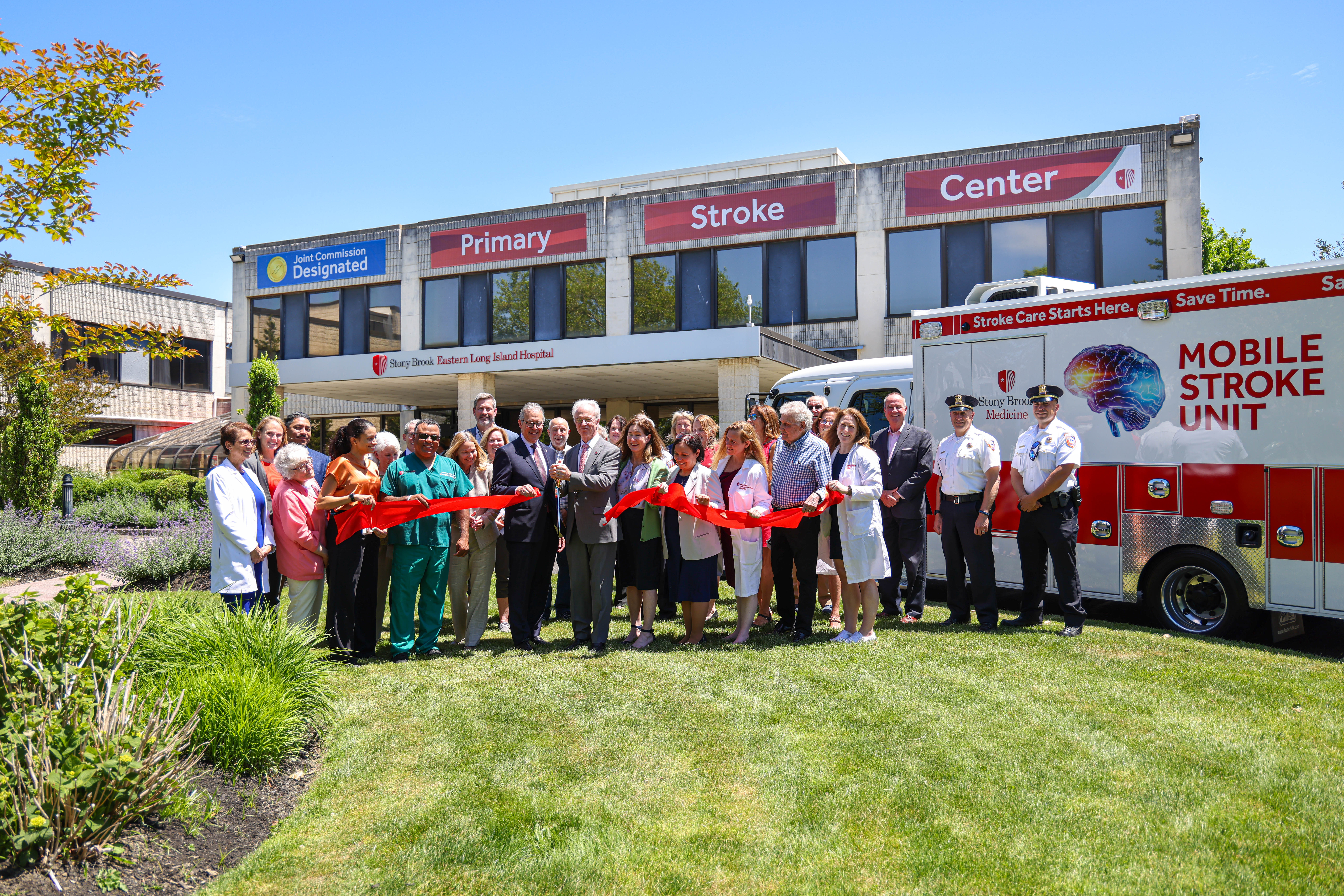 William Wertheim, MD, MBA, Executive Vice President of Stony Brook Medicine, and Paul J. Connor, III, Chief Administrative Officer Stony Brook Eastern Long Island Hospital (center with scissors), joined by Stony Brook Eastern Long Island Hospital leadership and staff, local elected officials, EMS representatives, representatives from the Southold Town Police Department at the ribbon cutting-ceremony for Stony Brook Eastern Long Island Hospital’s Primary Stroke Center.