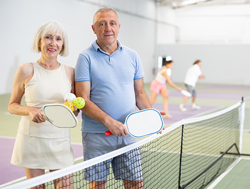 Couple playing pickleball